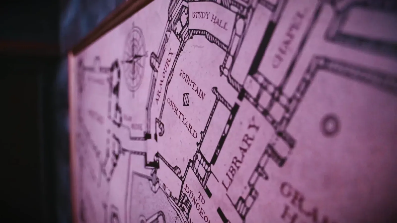 A hand-drawn castle map in The Wizard's Chamber marking the library, chapel and study hall